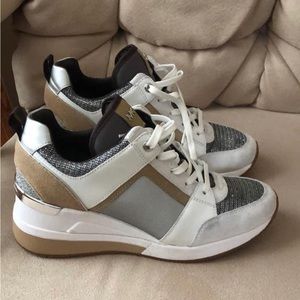 Brand New Michael Kors Tennis Shoes with wedge heal size 7.5